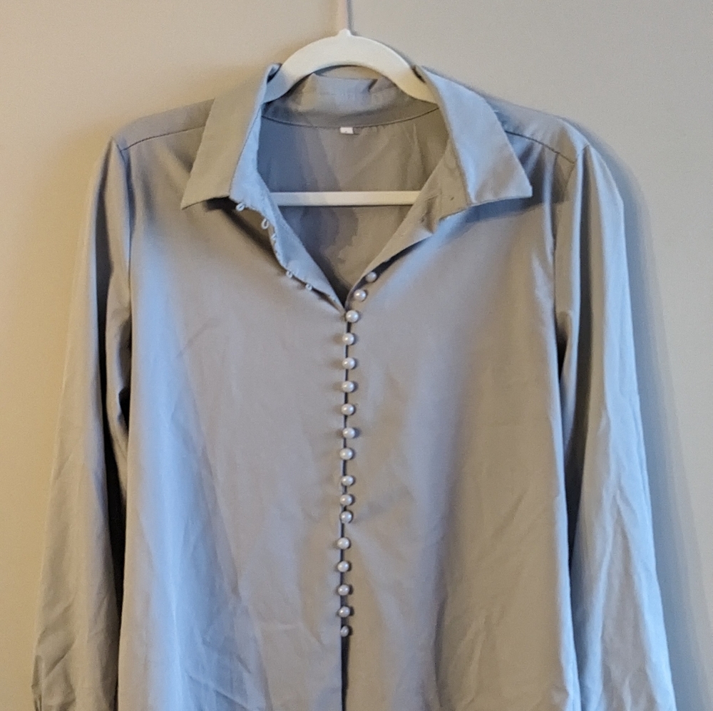 Grey long sleeve blouse with faux pearl button